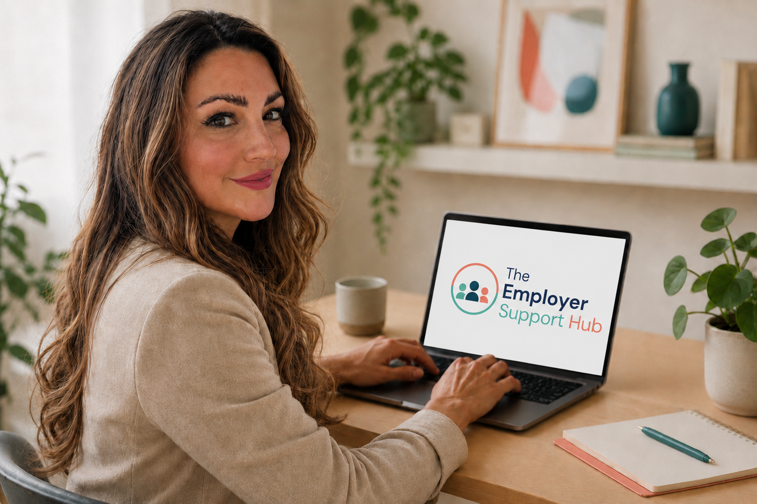 Charlotte, founder of The Employer Support Hub, working at her desk