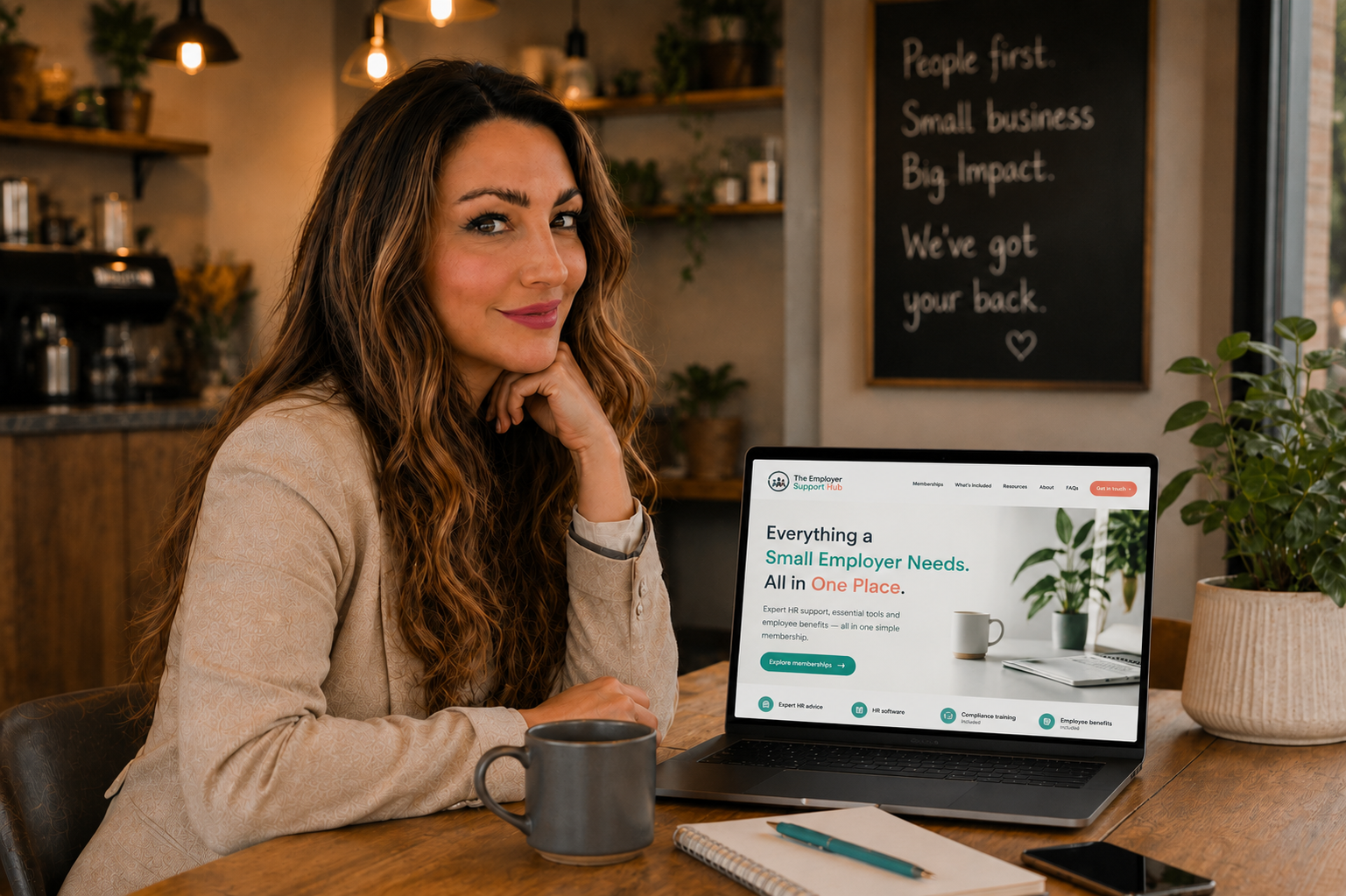 Founder of The Employer Support Hub working on a laptop in a café